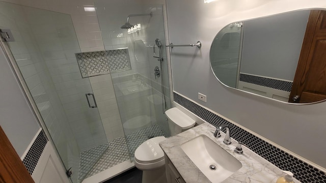 5448 W Agatite Ave, Chicago, IL 60630 - bathroom with a shower stall, vanity, and a wainscoted wall