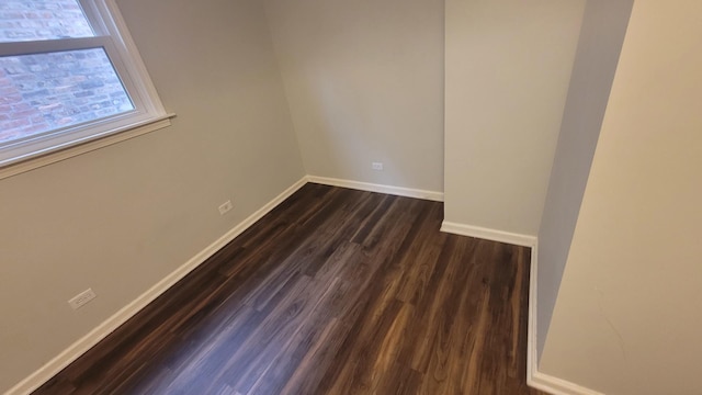 5448 W Agatite Ave, Chicago, IL 60630 - empty room featuring dark wood-style floors and baseboards