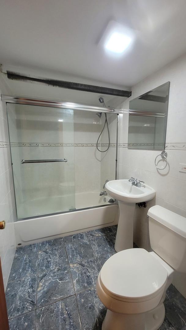 5448 W Agatite Ave, Chicago, IL 60630 - bathroom with bath / shower combo with glass door, tile walls, and marble finish flooring