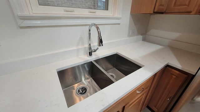 5448 W Agatite Ave, Chicago, IL 60630 - kitchen view of brown cabinetry and light stone counters