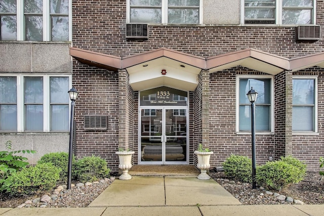 1333 W Touhy Ave Unit 102, Park Ridge, IL 60068 - view of exterior entry featuring brick siding
