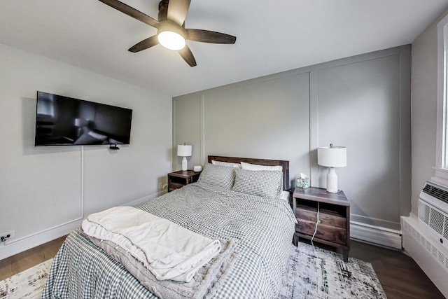 1333 W Touhy Ave Unit 102, Park Ridge, IL 60068 - bedroom with wood finished floors, ceiling fan, and a decorative wall