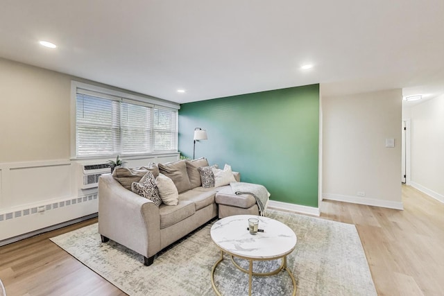 1333 W Touhy Ave Unit 102, Park Ridge, IL 60068 - living area featuring a baseboard heating unit, wood finished floors, and recessed lighting