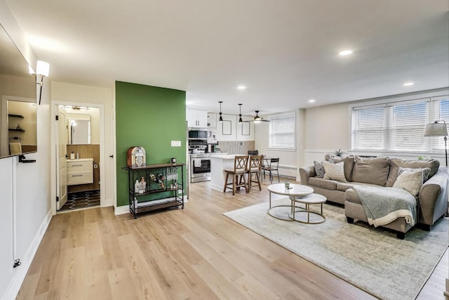 1333 W Touhy Ave Unit 102, Park Ridge, IL 60068 - living room featuring light wood-type flooring, ceiling fan, and recessed lighting
