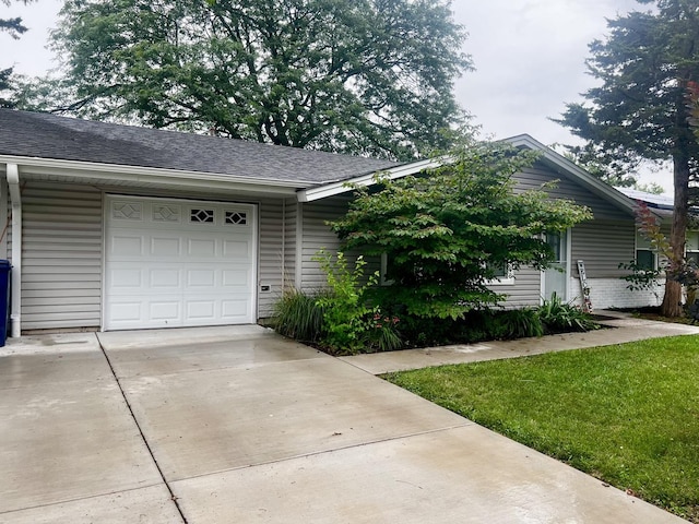 225 Webster Ln, Schaumburg, IL 60193 - view of front of house featuring driveway, an attached garage, and a shingled roof