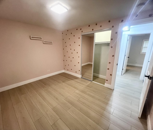 225 Webster Ln, Schaumburg, IL 60193 - unfurnished bedroom with light wood-style flooring and a closet