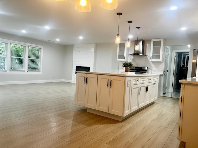 225 Webster Ln, Schaumburg, IL 60193 - kitchen with wall chimney range hood, a fireplace, light wood-type flooring, white cabinetry, and recessed lighting