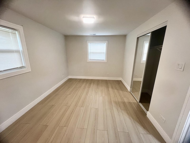 225 Webster Ln, Schaumburg, IL 60193 - empty room with light wood finished floors and baseboards