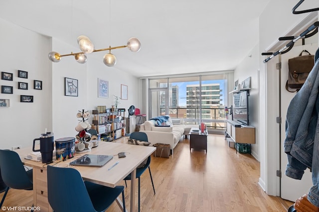 100 E 14th St Unit 1108, Chicago, IL 60605 - dining area with light wood-style flooring and floor to ceiling windows
