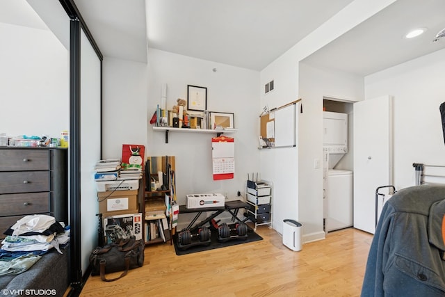 100 E 14th St Unit 1108, Chicago, IL 60605 - bedroom with estacked washer and dryer and wood finished floors