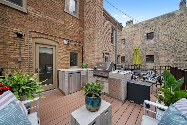 2113 N Clark St, Chicago, IL 60614 - wooden deck with exterior kitchen and outdoor dining area