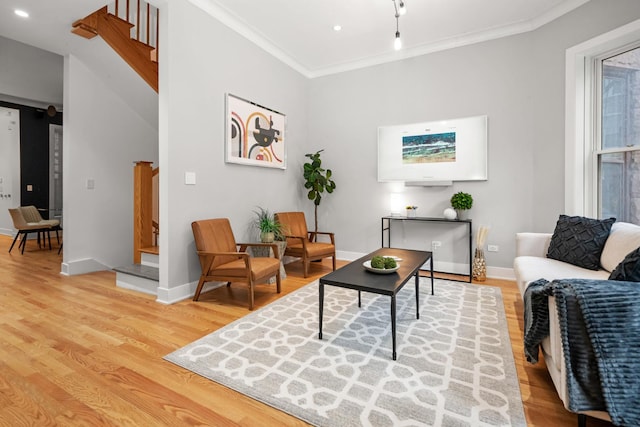 2113 N Clark St, Chicago, IL 60614 - living room featuring light wood-style flooring, ornamental molding, a barn door, recessed lighting, and stairway