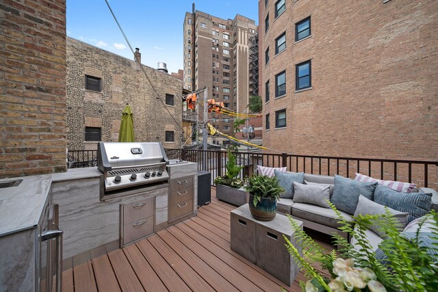 2113 N Clark St, Chicago, IL 60614 - wooden terrace with grilling area and an outdoor living space