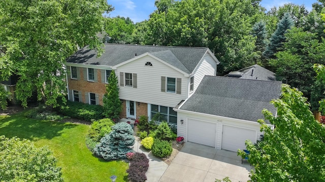 4049 Michelline Ln, Northbrook, IL 60062 - colonial house featuring an attached garage, driveway, a front yard, and a shingled roof