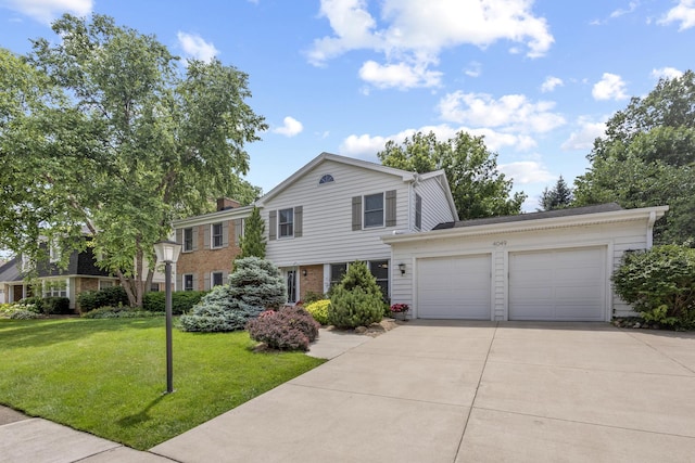 4049 Michelline Ln, Northbrook, IL 60062 - view of front of property with a garage, driveway, a front yard, and brick siding
