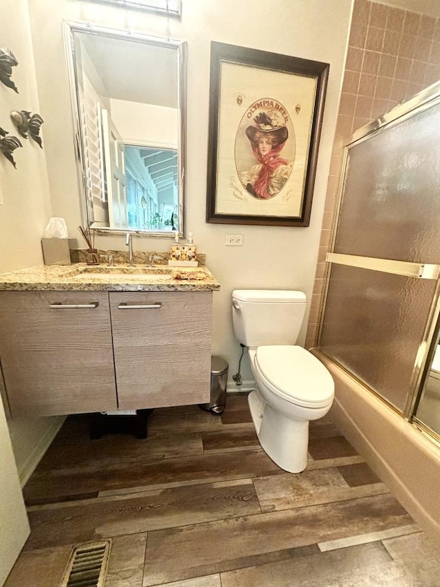 4049 Michelline Ln, Northbrook, IL 60062 - full bath with wood finished floors, vanity, and bath / shower combo with glass door