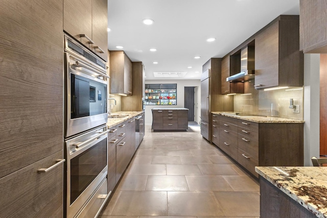 4049 Michelline Ln, Northbrook, IL 60062 - kitchen featuring stainless steel appliances, wall chimney range hood, dark brown cabinets, modern cabinets, and recessed lighting