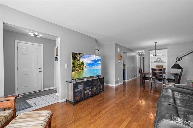 906 Whitetail Ln, Sandwich, IL 60548 - living room featuring a chandelier and light wood-type flooring