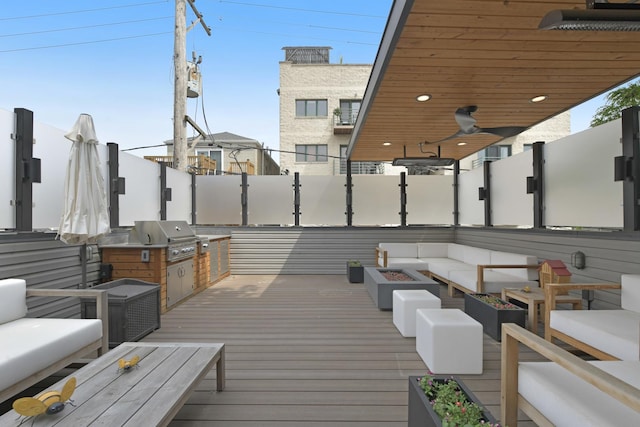 2036 W Huron St, Chicago, IL 60612 - wooden deck with an outdoor living space with a fire pit, exterior kitchen, and ceiling fan
