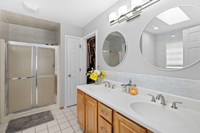 18049 Brittany Ln, Lansing, IL 60438 - full bath featuring a stall shower, tile patterned flooring, and double vanity