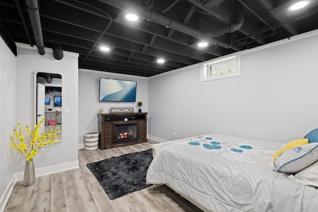 18049 Brittany Ln, Lansing, IL 60438 - bedroom with wood finished floors and a glass covered fireplace