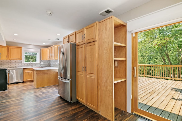 1479 Exeter Ct, Hoffman Estates, IL 60010 - kitchen with appliances with stainless steel finishes, light brown cabinetry, dark wood finished floors, and light countertops