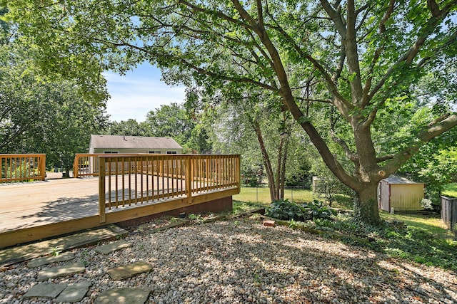 1479 Exeter Ct, Hoffman Estates, IL 60010 - view of yard featuring a storage unit and a wooden deck