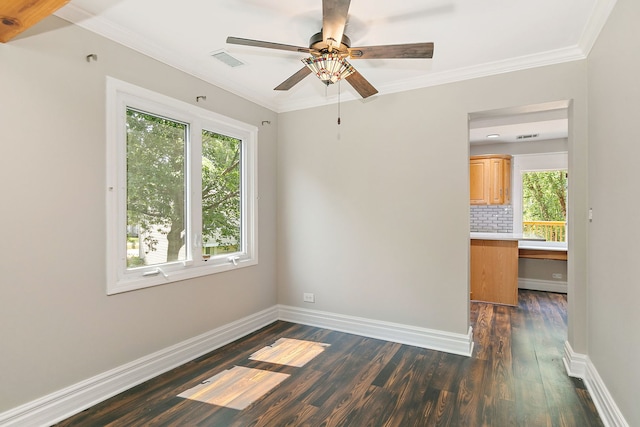 1479 Exeter Ct, Hoffman Estates, IL 60010 - spare room featuring dark wood-style flooring, crown molding, and ceiling fan