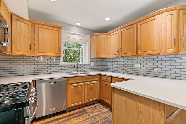 1479 Exeter Ct, Hoffman Estates, IL 60010 - kitchen with appliances with stainless steel finishes, light countertops, dark wood-type flooring, recessed lighting, and backsplash