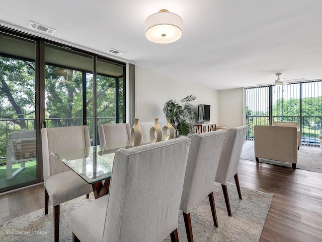 123 Acacia Cir Unit 414, Indian Head Park, IL 60525 - dining room featuring floor to ceiling windows, wood finished floors, and ceiling fan