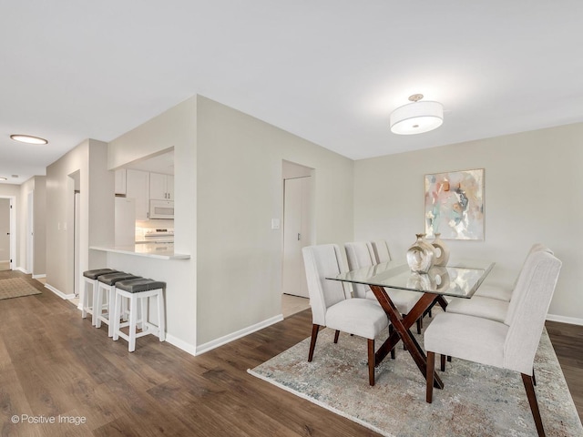 123 Acacia Cir Unit 414, Indian Head Park, IL 60525 - dining room featuring dark wood-style floors and baseboards
