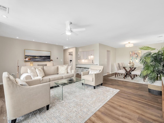 123 Acacia Cir Unit 414, Indian Head Park, IL 60525 - living area featuring wood finished floors, a ceiling fan, and recessed lighting