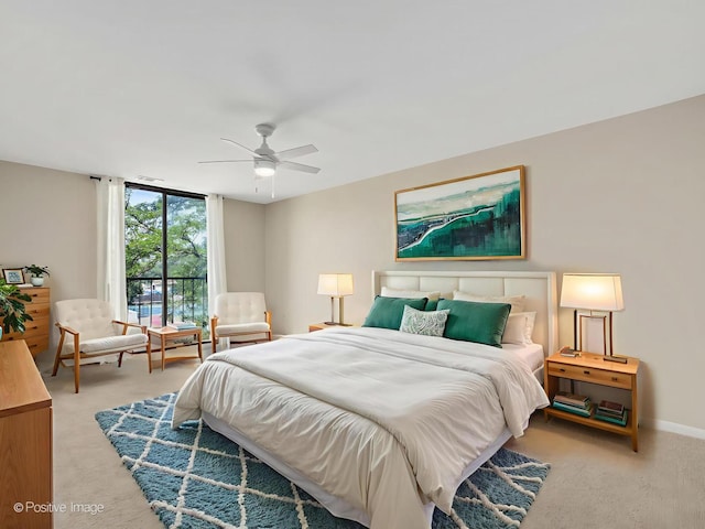 123 Acacia Cir Unit 414, Indian Head Park, IL 60525 - bedroom featuring light colored carpet, a wall of windows, and a ceiling fan