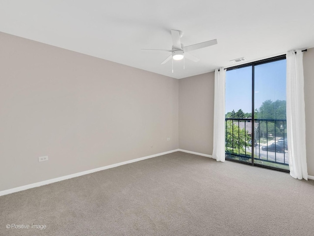 123 Acacia Cir Unit 414, Indian Head Park, IL 60525 - carpeted empty room featuring a ceiling fan and floor to ceiling windows