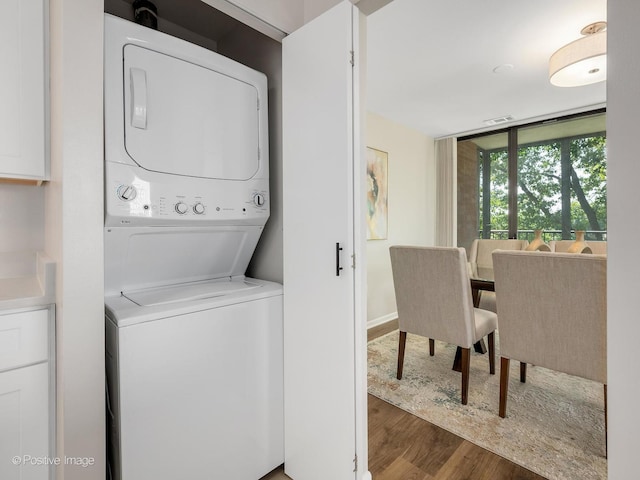 123 Acacia Cir Unit 414, Indian Head Park, IL 60525 - washroom with stacked washer / drying machine and wood finished floors