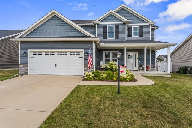 806 Cole Ln, Mahomet, IL 61853 - view of front facade featuring stone siding, an attached garage, driveway, and a front yard