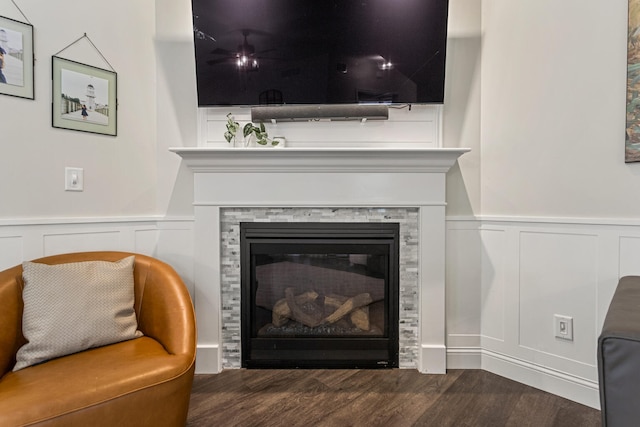 806 Cole Ln, Mahomet, IL 61853 - detailed view of wood finished floors, a decorative wall, a wainscoted wall, and a glass covered fireplace