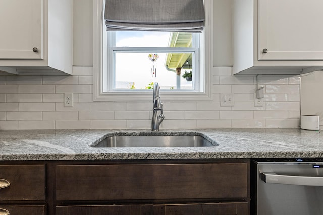 806 Cole Ln, Mahomet, IL 61853 - kitchen with dark brown cabinets, dishwasher, light stone countertops, and decorative backsplash