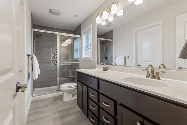 806 Cole Ln, Mahomet, IL 61853 - bathroom featuring double vanity and a shower stall