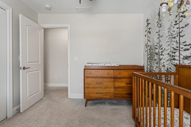 806 Cole Ln, Mahomet, IL 61853 - bedroom featuring light carpet and a crib