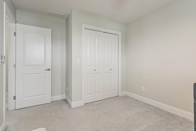 806 Cole Ln, Mahomet, IL 61853 - unfurnished bedroom featuring light carpet and a closet