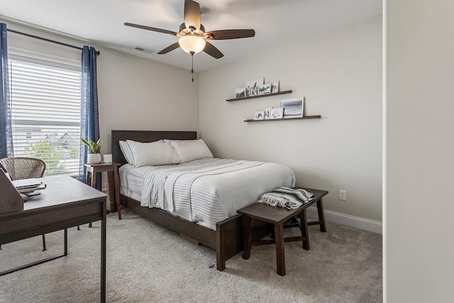 806 Cole Ln, Mahomet, IL 61853 - carpeted bedroom with a desk and a ceiling fan