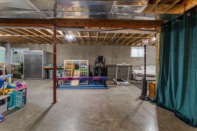 806 Cole Ln, Mahomet, IL 61853 - below grade area featuring stainless steel refrigerator