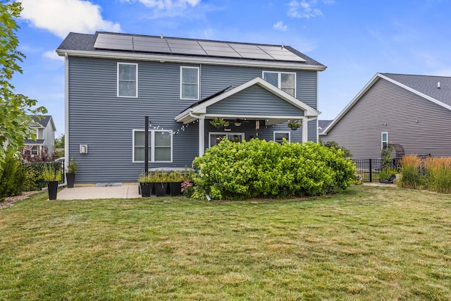 806 Cole Ln, Mahomet, IL 61853 - back of property featuring roof mounted solar panels and a patio