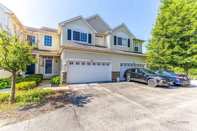 696 S Jade Ln, Round Lake, IL 60073 - view of front facade with a garage and asphalt driveway