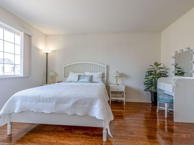 696 S Jade Ln, Round Lake, IL 60073 - bedroom with wood finished floors and baseboards