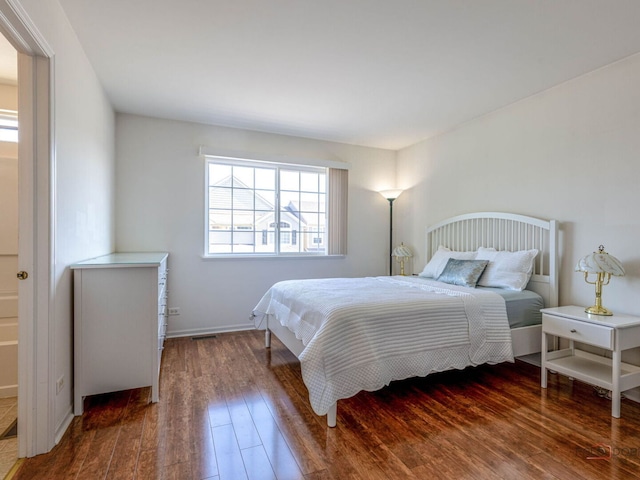 696 S Jade Ln, Round Lake, IL 60073 - bedroom with wood-type flooring and baseboards