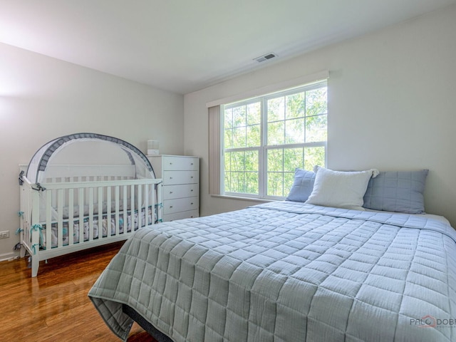 696 S Jade Ln, Round Lake, IL 60073 - bedroom featuring wood finished floors and baseboards