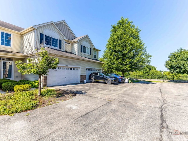 696 S Jade Ln, Round Lake, IL 60073 - view of front of home featuring an attached garage and driveway