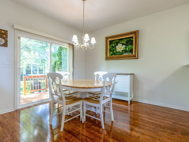 696 S Jade Ln, Round Lake, IL 60073 - dining space featuring hardwood / wood-style flooring and a chandelier